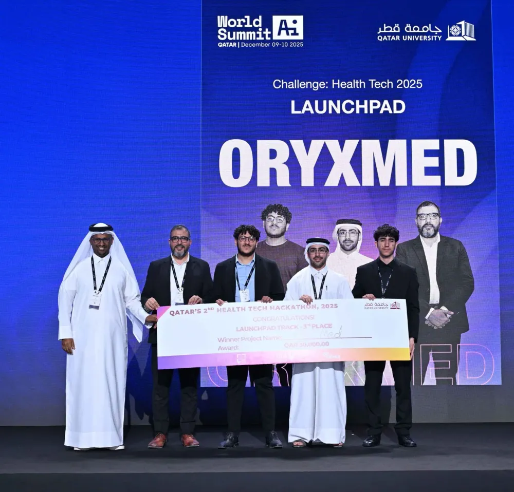 The OryxMed team on stage at World Summit AI Qatar, holding the 30,000 QAR cheque for third place in the Health Tech Hackathon Launchpad track